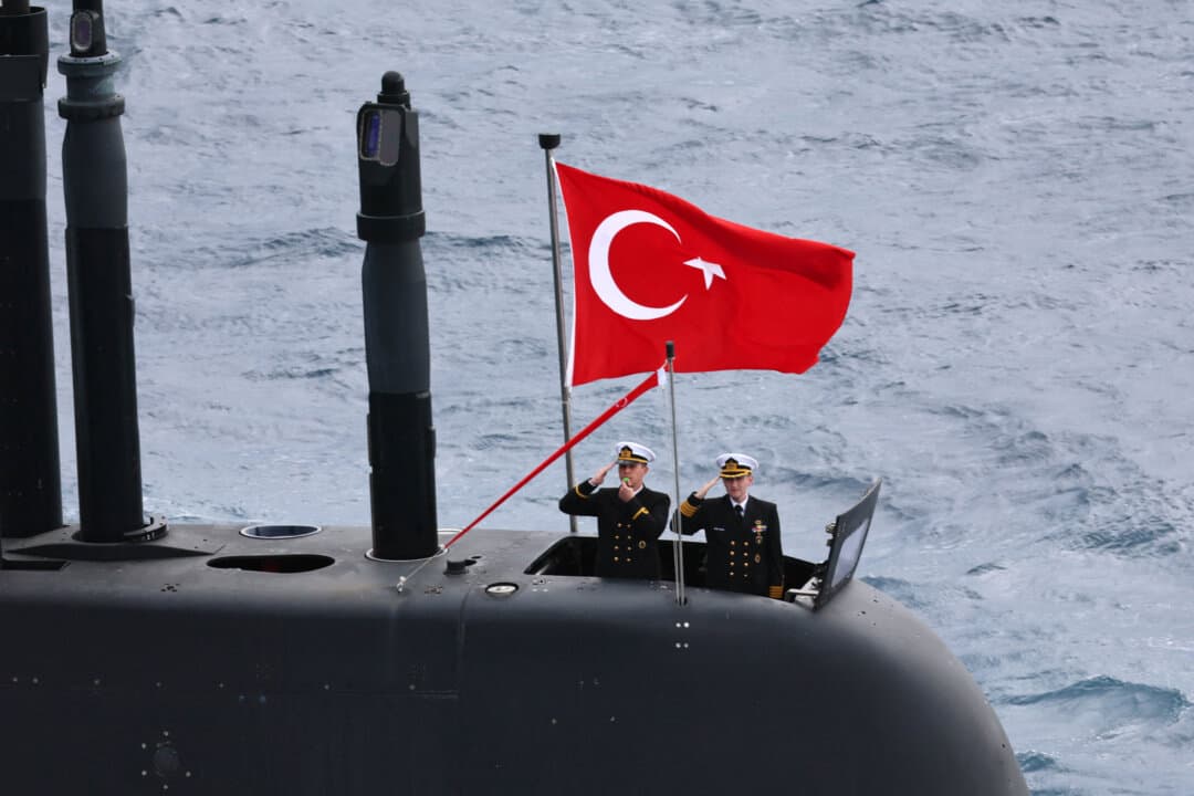 Turkey's servicemen stand at attention on a Turkish submarine as they participate in the live-fire phase of the “Blue Homeland-2026” (Mavi Vatan) tactical military exercises in the eastern Mediterranean Sea, in Antalya, Turkey, on April 9, 2026. (Adem Altan/AFP via Getty Images)