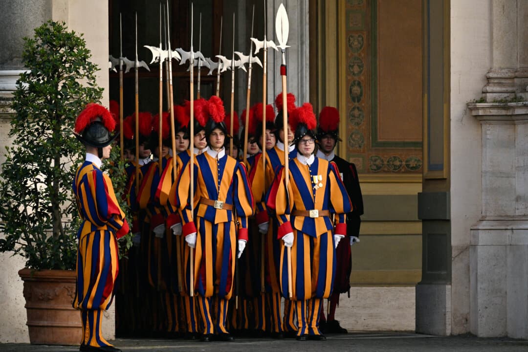 Swiss Guards take position before the arrival of French President Emmanuel Macron and his wife, Brigitte, for an audience with Pope Leo XIV, in the Vatican on April 10, 2026. (Tiziana Fabi/AFP via Getty Images)