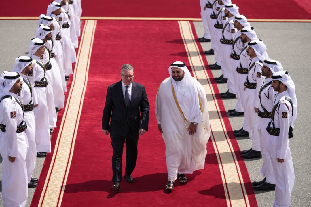 Qatar's Minister of State Muhammed Al Khulaifi bids farewell to Britain's Prime Minister Keir Starmer at the airport in Doha, Qatar, on April 10, 2026. (Alastair Grant/POOL/AFP via Getty Images)