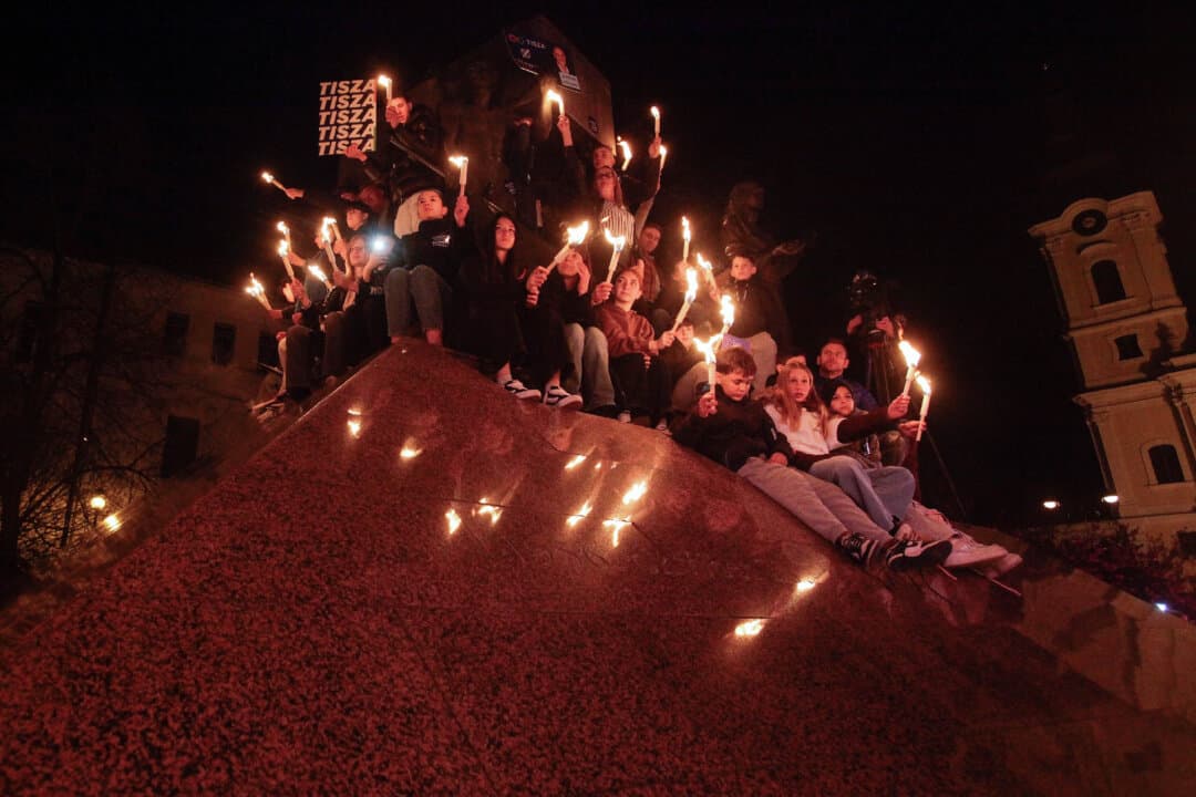Supporters of the Tisza Party hold torches at a campaign rally, during a nationwide tour ahead of the election, in Miskolc, Hungary, on April 10, 2026. (Peter Kohalmi/AFP via Getty Images)