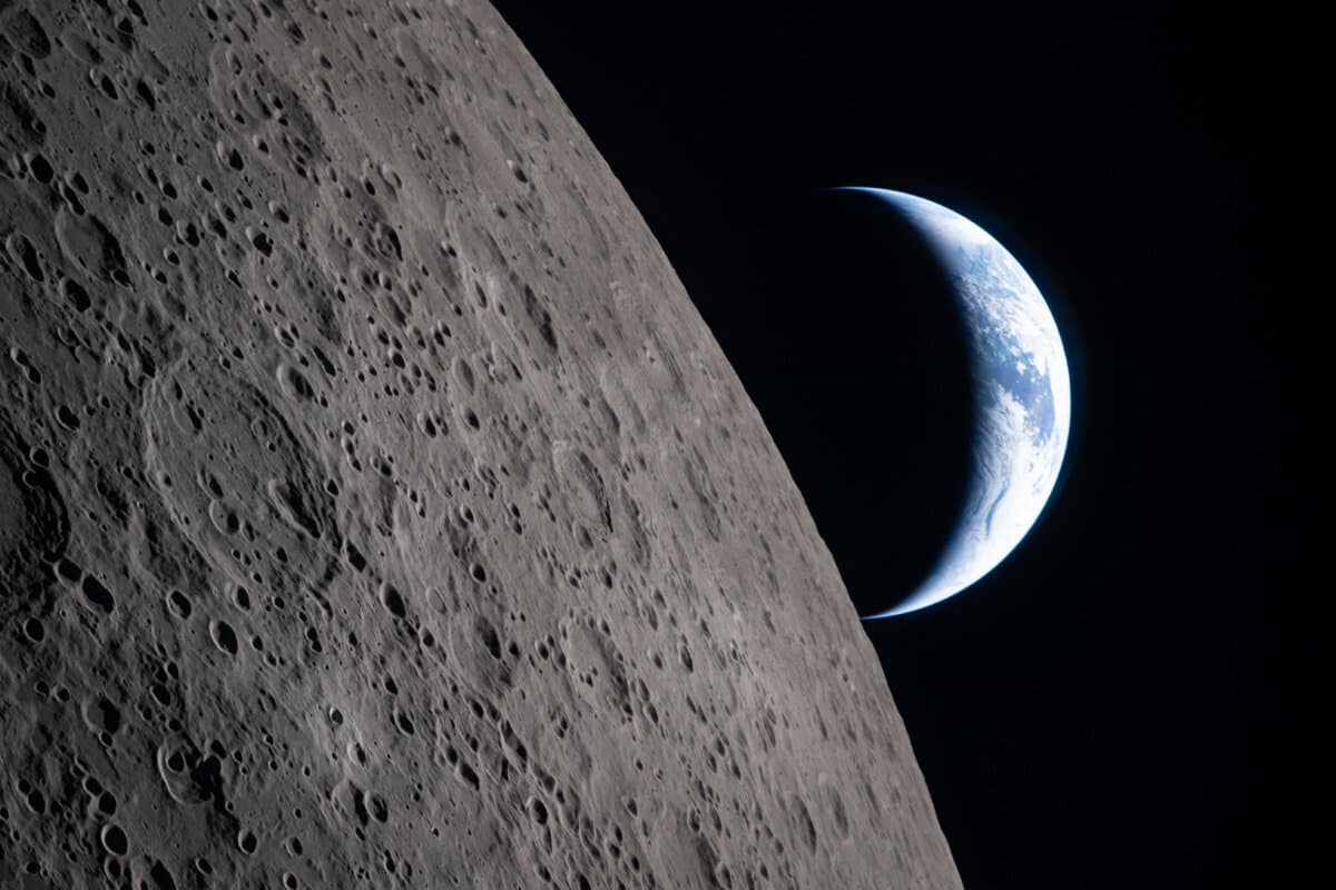 The Artemis II crew came close to passing behind the Moon and experiencing a planned loss of signal; they captured this image of a crescent Earth setting on the Moon’s limb on April 6, 2026. (NASA via Getty Images)