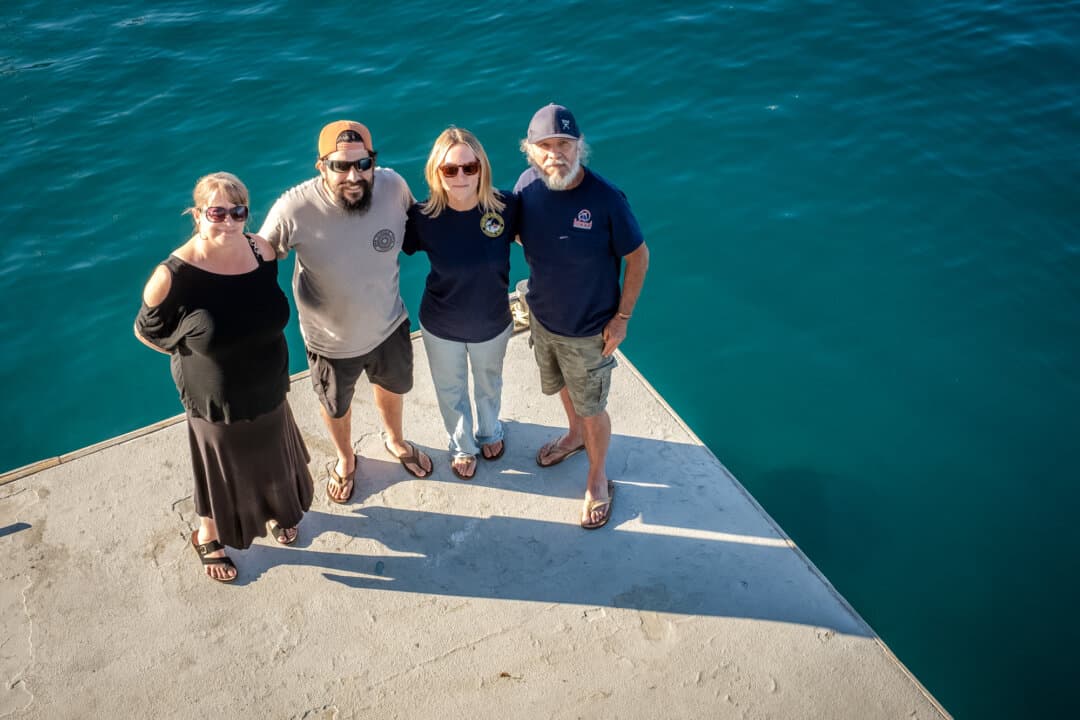 (L–R) Coalition to Save Catalina Island Deer members Wendy Hernandez, Taylor Bussard, Bre Bussard, and Pastor Lopez stand on a dock in Avalon, Calif., on March 18, 2026. Hernandez said that the coalition is “very aware” that the number of deer on the island needs to be controlled, but “how that happens is where we get concerned.” (John Fredricks/The Epoch Times)