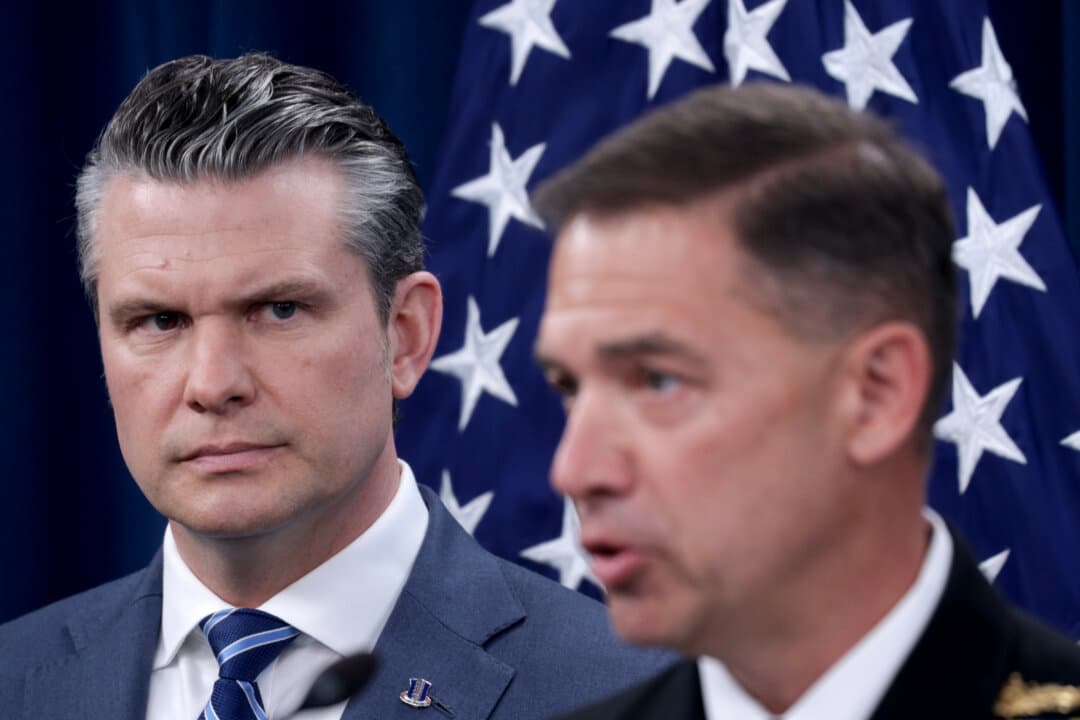 U.S. Secretary of War Pete Hegseth listens as Adm. Brad Cooper, commander of U.S. Central Command, speaks during a press briefing at the Pentagon in Arlington, Va., on April 16, 2026. (Alex Wong/Getty Images)