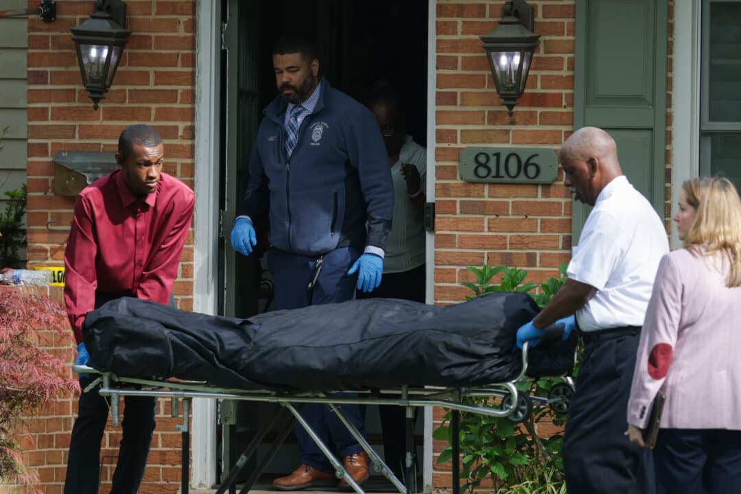 A body is removed on a gurney from a crime scene outside the home of former Virginia Lt. Gov. Justin Fairfax in Annandale, Virginia, on April 16, 2026. According to police, Justin Fairfax and his wife, Cerina Fairfax, were found dead in a murder-suicide at their home. (Alex Wong/Getty Images)
