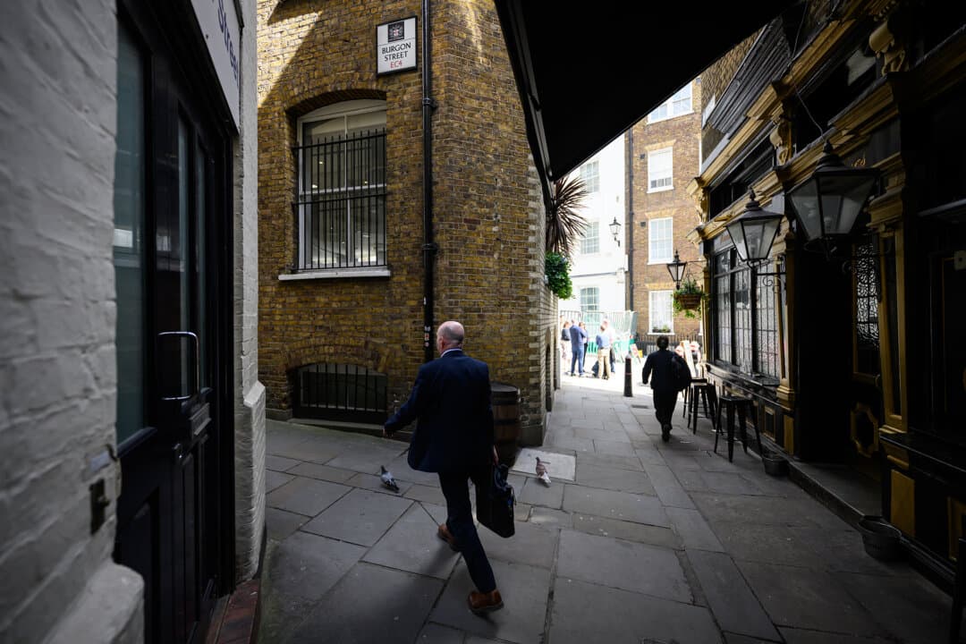 A man walks along Ireland Yard, which has now been confirmed as the location of a former home of William Shakespeare, in London, on April 16, 2026. Using newly uncovered documents from the London Archives and the National Archives, Professor Lucy Munro of King's College London identified the location and size of the Blackfriars property bought by William Shakespeare in 1613. (Leon Neal/Getty Images)