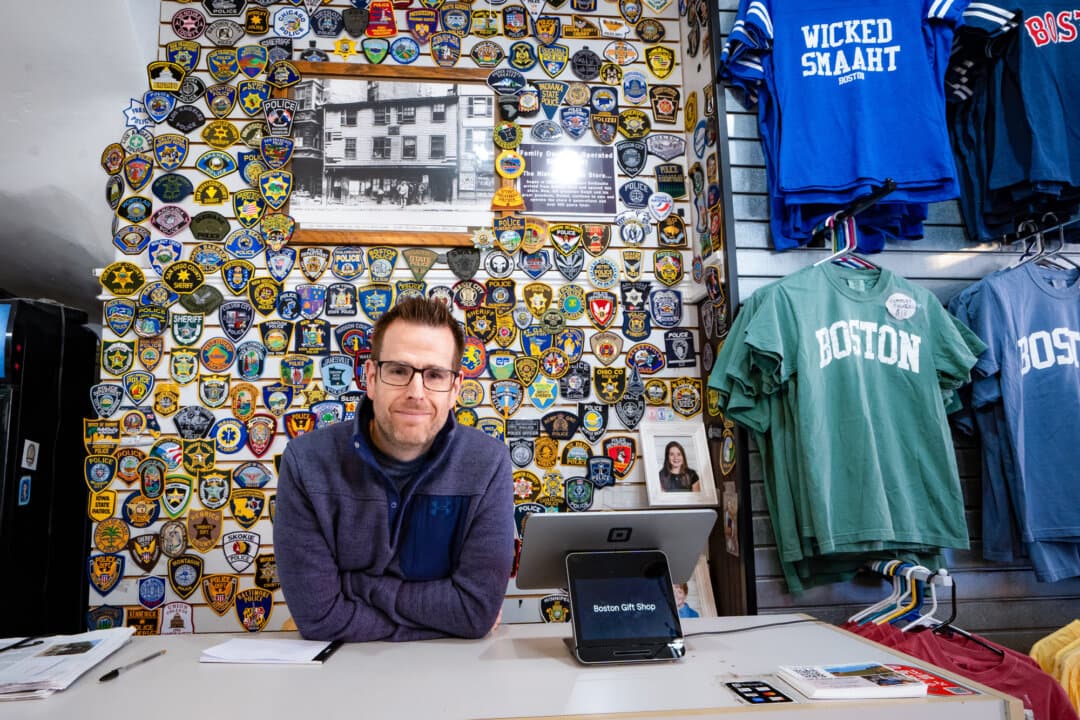 Dan DelGaudio stands inside his shop next to the Paul Revere House in Boston on April 8, 2026. DelGaudio’s family has operated the store since 1894, and it has been sustained for four generations by tourists visiting the historic site, he said. (Samira Bouaou/The Epoch Times)