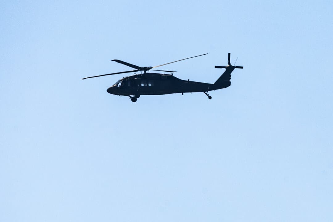 A Blackhawk helicopter flies over Fort Benning, Ga. on April 9, 2026. (John Fredricks/The Epoch Times)