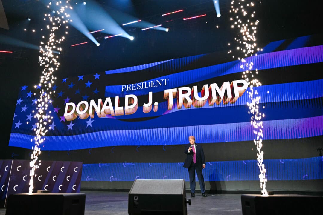 President Donald Trump arrives on stage to address a Turning Point USA event at Dream City Church in Phoenix on April 17, 2026. (Jim Watson/AFP via Getty Images)