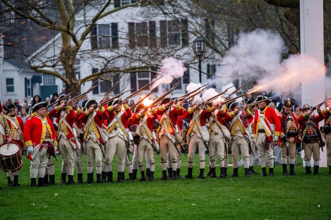 Reenactors dressed as a British soldiers fire during a battle reenactment of the Battle of Lexington and Concord as part of Patriot’s Day celebrations in Lexington, Mass., on April 18, 2026. April 19 marks the 250th anniversary of the Battle of Lexington and Concord, the first major military actions between the British Army and the Colonial American militias during the American Revolutionary War. (Joseph Prezioso/AFP via Getty Images)