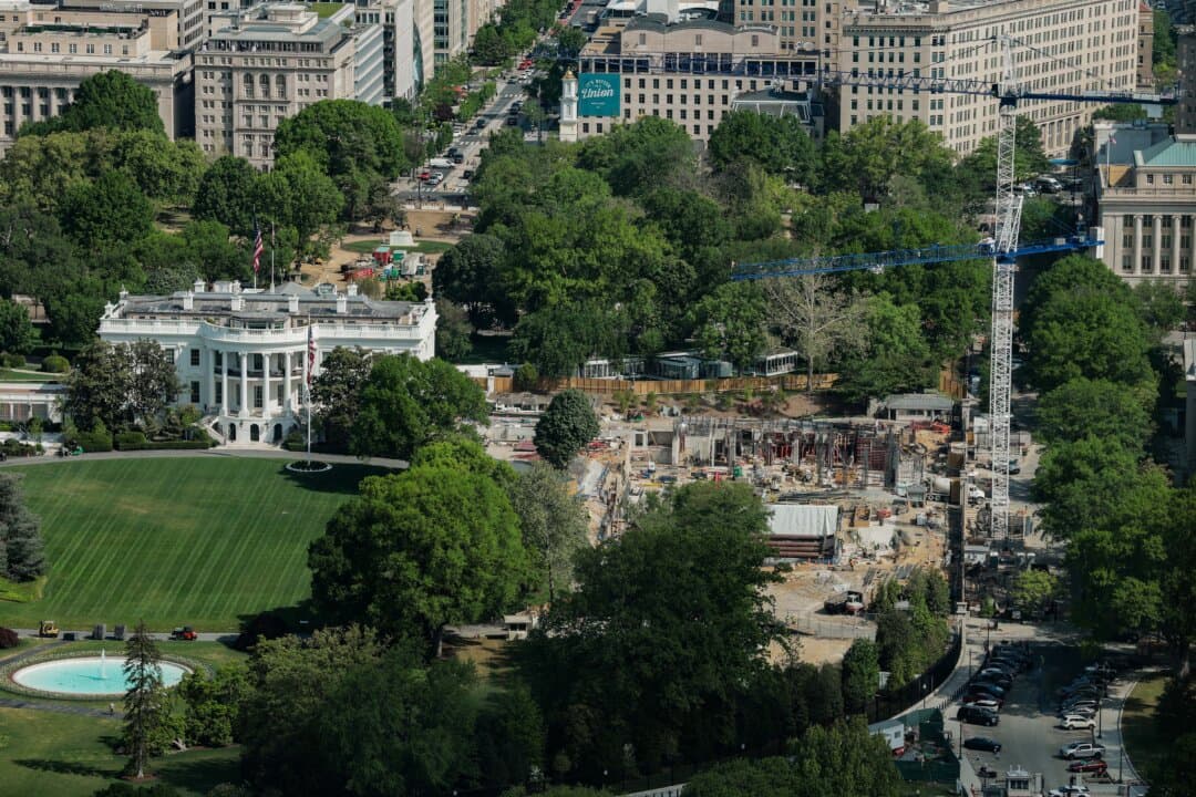 Construction cranes are seen, from the Washington Monument, on the site of the former East Wing of the White House on April 17, 2026. A federal judge released a revised order on April 16 blocking the Trump administration from above-ground construction work on the proposed White House ballroom, although the ruling was stalled a few days later on appeal. (Anna Moneymaker/Getty Images)
