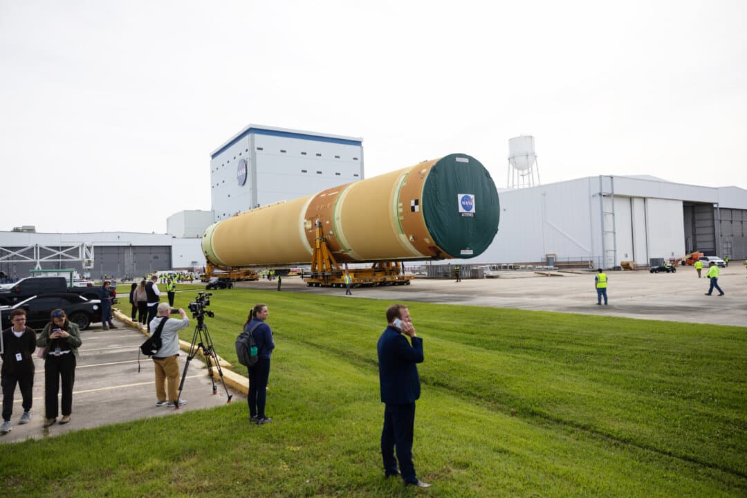 NASA rolls out the top four-fifths of the rocket core stage for the Artemis III mission from Michoud Assembly Facility in New Orleans on April 20, 2026. It will be loaded onto the Pegasus barge for delivery to Kennedy Space Center in Florida. Once there, teams will complete final outfitting and integration, with the four RS-25 engines scheduled to arrive from Stennis Space Center in Mississippi by July 2026. Artemis III, the second crewed Artemis mission following the successful Artemis II lunar flyby, is targeting a 2027 launch to test rendezvous and docking capabilities ahead of landing American astronauts on the moon in 2028. (Kathleen Flynn/Getty Images)