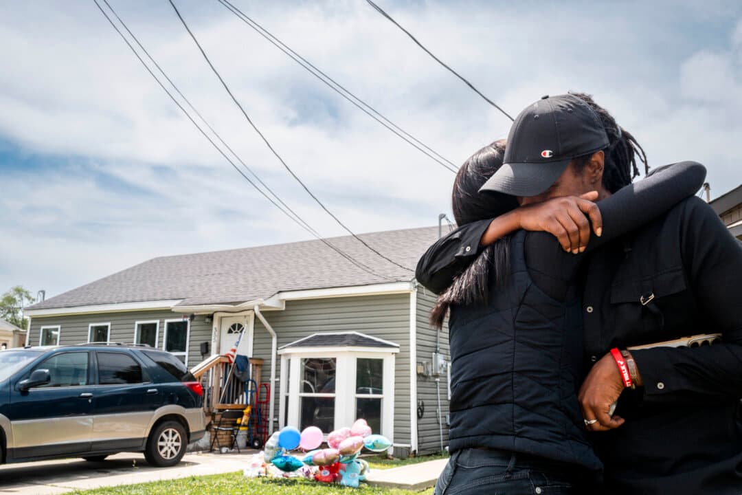People grieve in front of the home where a shooting spree occurred in Shreveport, La., on April 20, 2026. Eight children were killed and two women were wounded during a domestic violence incident in the early morning hours on April 19, according to local authorities. (Brandon Bell/Getty Images)