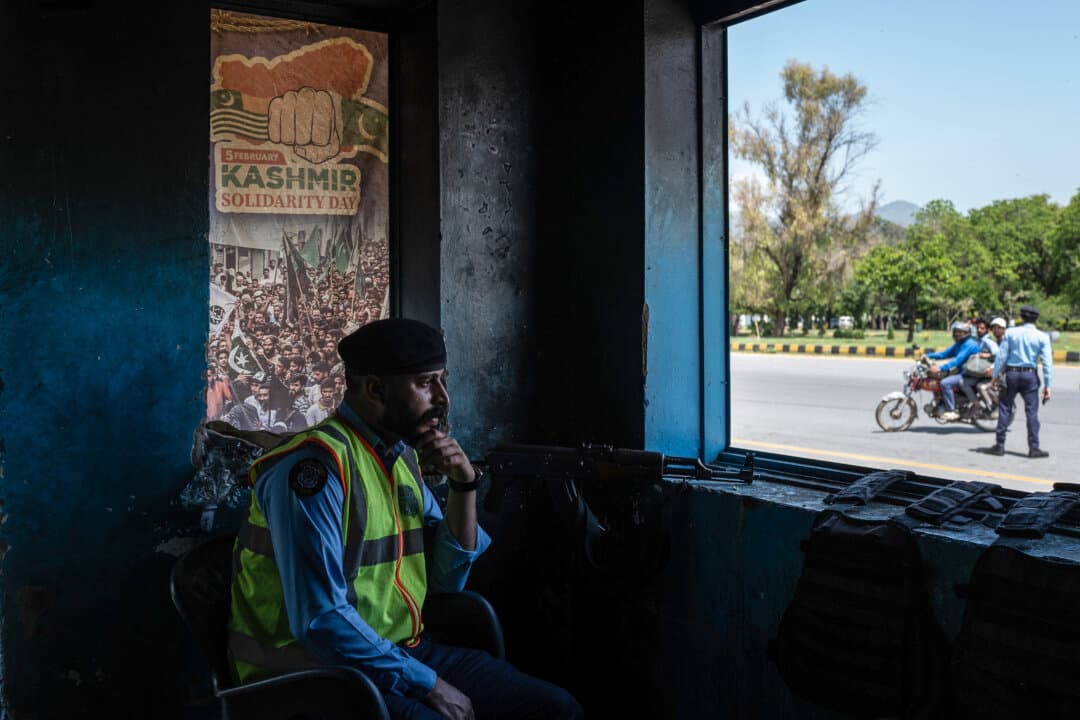 A member of Pakistani security looks over a checkpoint from a police booth amid heightened security ahead of a potential meeting between U.S. and Iranian officials in Islamabad on April 20, 2026. After a failed set of talks in Islamabad, speculation is rife that the U.S. and Iran might meet again to find a solution to their conflict and the closed Hormuz Strait. (Rebecca Conway/Getty Images)