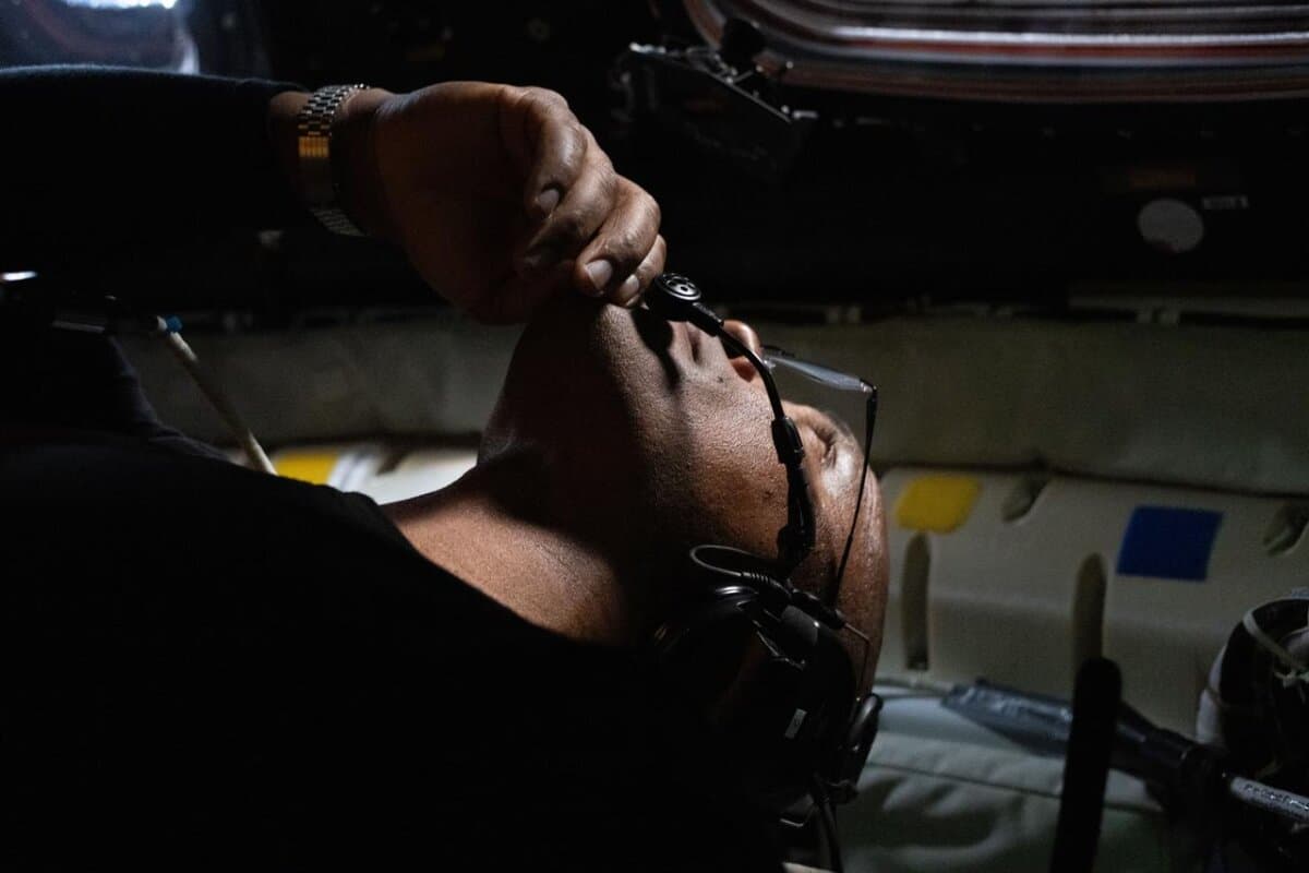 NASA astronaut and Artemis II pilot Victor Glover looks out the window of the Orion spacecraft during the lunar flyby on April 6, 2026. (Courtesy of NASA).