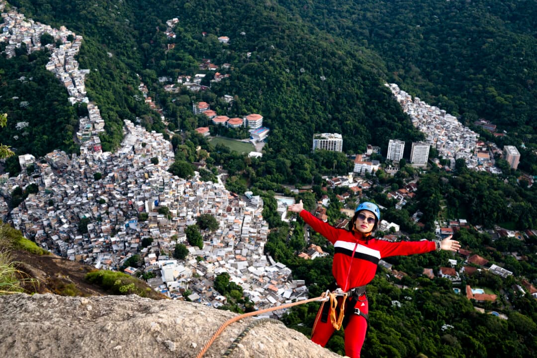 A tourist rappells at sunrise from Morro Dois Irmaos, reached via the Vidigal favela, in Rio de Janeiro on April 21, 2026. (Pablo Porciuncula/AFP via Getty Images)