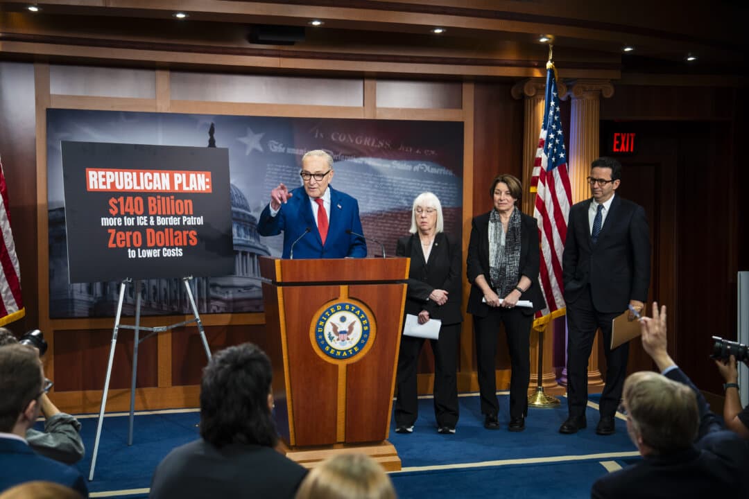 Senate Minority Leader Chuck Schumer (D-N.Y.) and other Senate Democrats speak to reporters on Capitol Hill on April 22, 2026. (Madalina Kilroy/The Epoch Times)