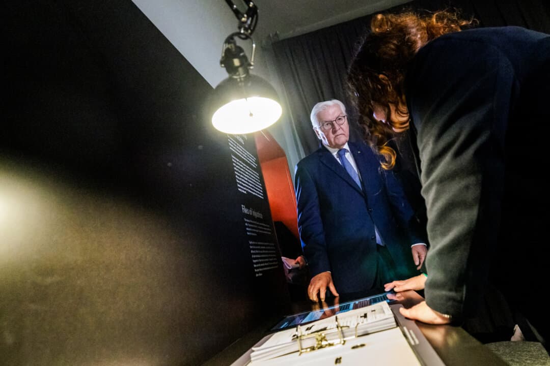 German President Frank-Walter Steinmeier listens during a tour at the memorial site of the former Closed Youth Detention Center in Torgau, Germany, on April 22, 2026. According to the memorial site, the detention center used to be the only high-security residential care facility in the German Democratic Republic, where young people were to be re-educated into “socialist personalities” within just a few months. About 135,000 children and young people were forced to go through socialist re-education practices in youth work camps and special children's homes. (Jens Schlüter/Pool/AFP via Getty Images)