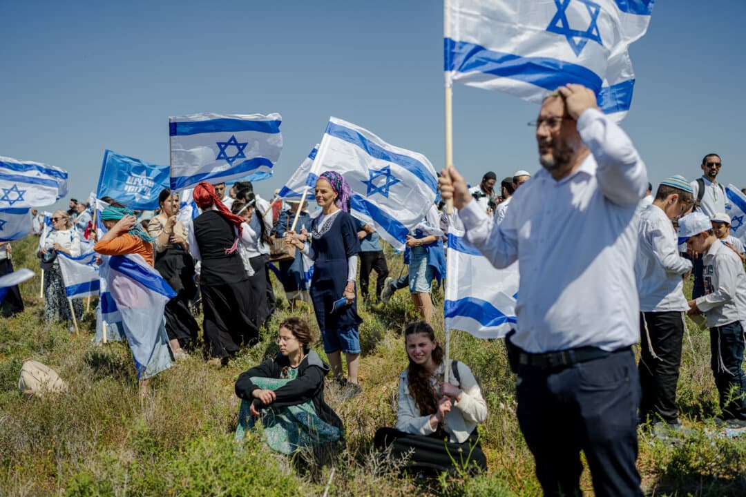 Nachala movement settlers march near the Gaza border, advocating for the resettlement of the Gaza Strip, near Kibbutz Nir Am as Israelis observe Yom Ha'atzmaut, National Independence Day, near Kibbutz Nir Am, Israel, on April 22, 2026. (Erik Marmor/Getty Images)