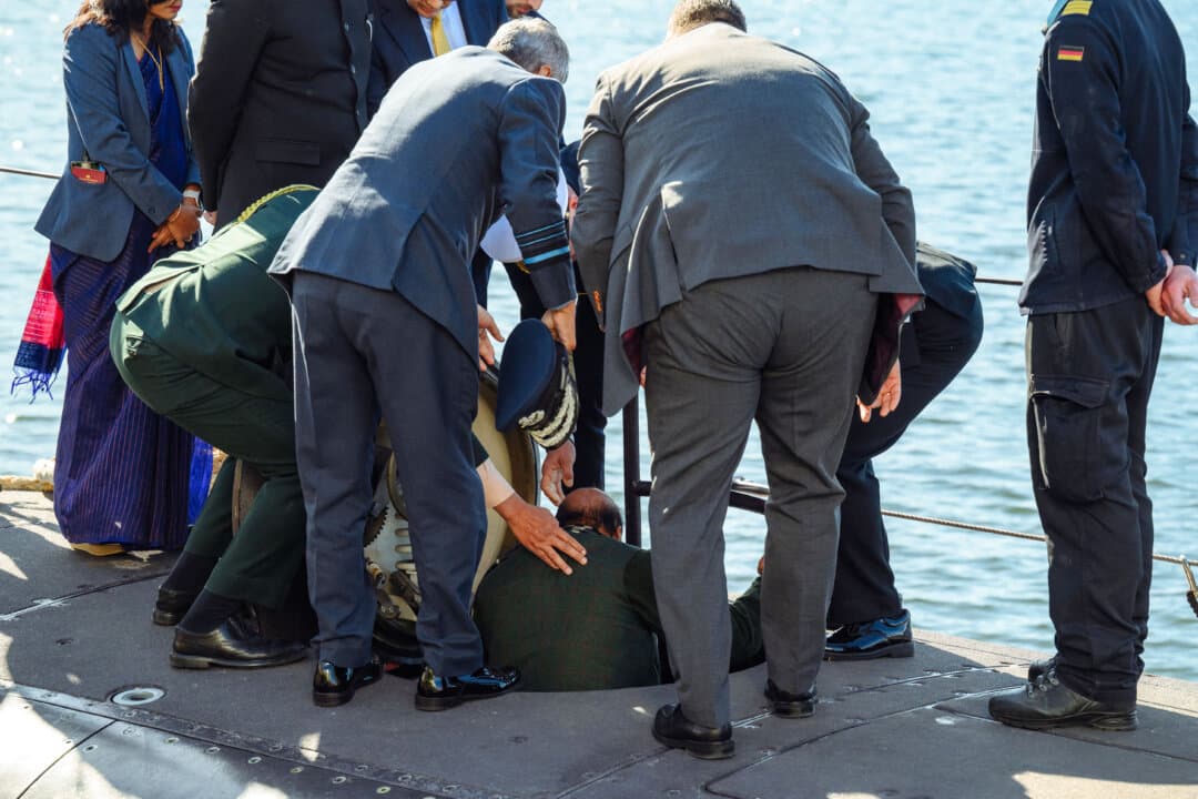 Indian Defense Minister Rajnath Singh (C) climbs down the ladder of a U-34 submarine as he visits the TKMS (ThyssenKrupp Marine Systems) submarine shipyard with his German counterpart in Kiel, northern Germany, on April 22, 2026. (Gregor Fischer/AFP via Getty Images)