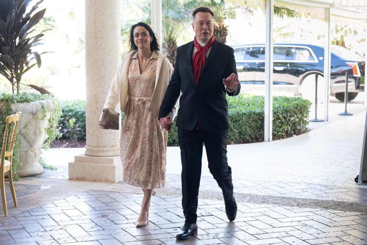 Elon Musk, CEO of Tesla and SpaceX, and Shivon Zilis, a venture capitalist, arrive to attend the wedding of Dan Scavino, White House deputy chief of staff, and Erin Elmore, the Department of State director of art in embassies, at Mar-a-Lago in Palm Beach, Fla., on Feb. 1, 2026. (Saul Loeb/AFP via Getty Images)