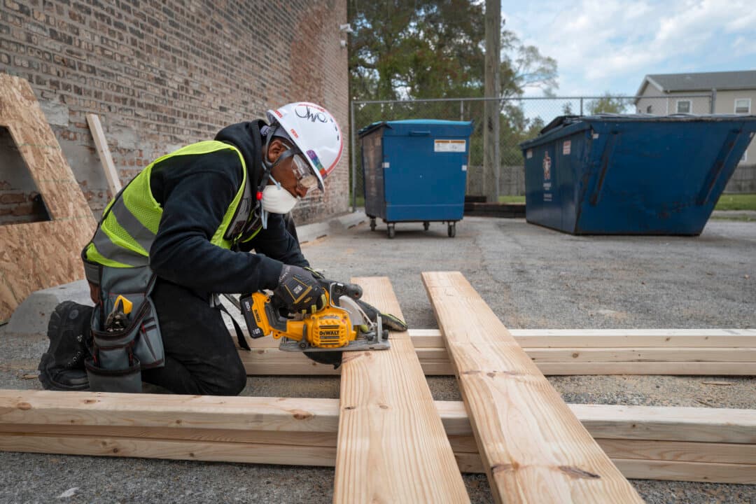 Students learn construction skills at Revolution Workshop in Chicago on May 8, 2026. Revolution Workshop is a non-profit organization that offers students between the ages of 18 and 40 a stipend to attend a 12-week program to prepare them for a trade union apprenticeship program. People are being lured back to the trades by good pay and job opportunities, as skilled workers age out of the workforce and concerns about how AI will affect white-collar job opportunities. (Scott Olson/Getty Images)