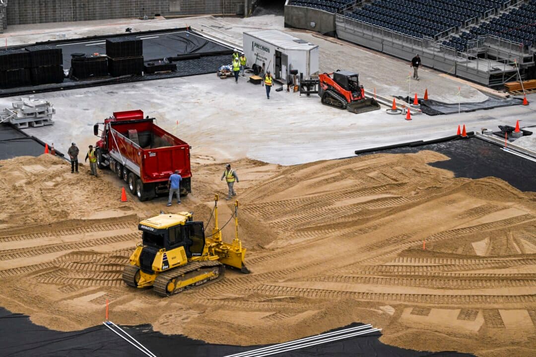 Workers prepare Houston Stadium (temporarily renamed from NRG Stadium) for the 2026 FIFA World Cup in Houston, Texas, on May 11, 2026. Houston Stadium will host seven soccer matches during the 2026 FIFA World Cup. (Ronaldo Schemidt/AFP via Getty Images)