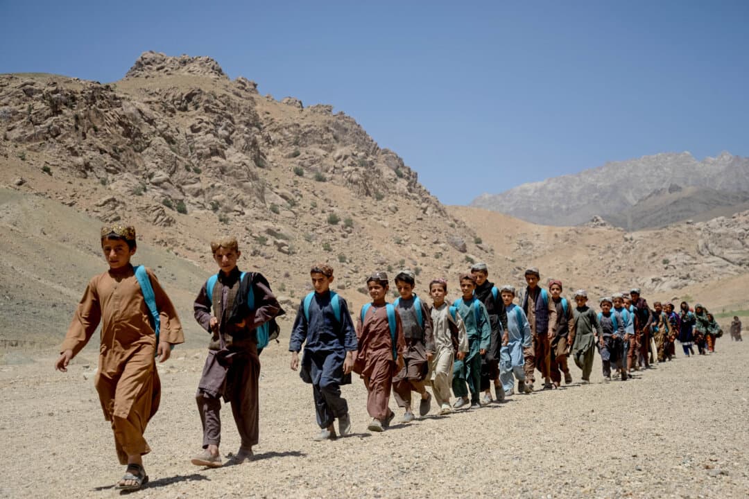 Afghan children leave after attending a primary school in Khvajeh Atis village, Afghanistan, on May 11, 2026. (Sanaullah Seiam/AFP via Getty Images)
