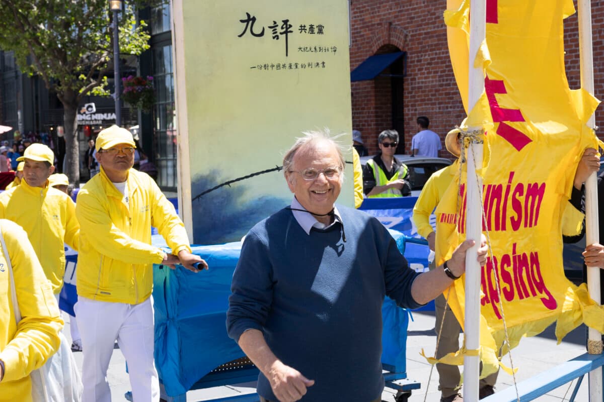Retired seafood business owner Wayne Hankins participates in the Falun Dafa parade in San Francisco on May 9, 2026. (Lear Zhou/The Epoch Times)