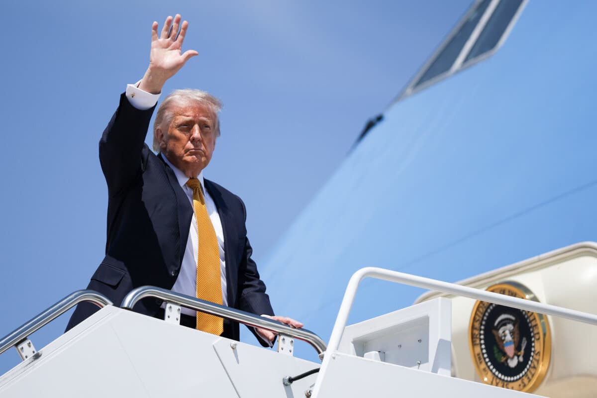 President Donald Trump waves as he boards Air Force One at Joint Base Andrews, Md., on May 12, 2026. (Alex Wong/Getty Images)