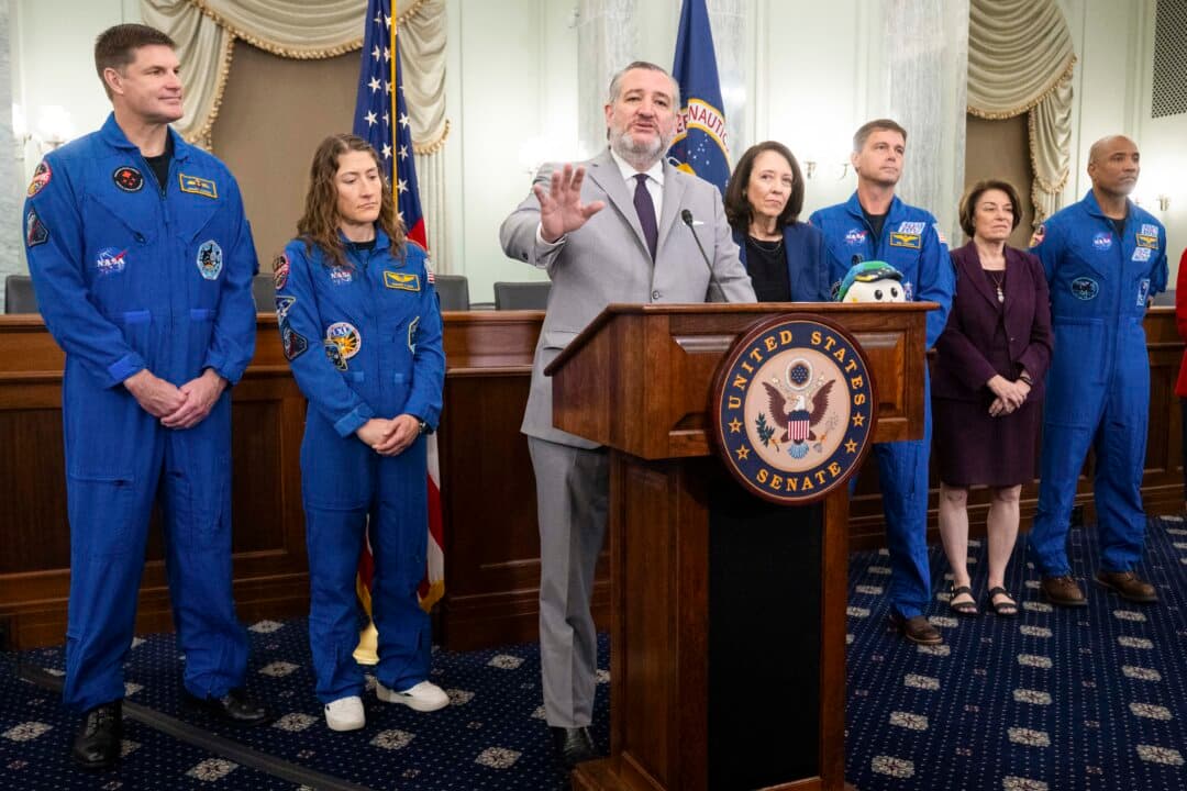 Sen. Ted Cruz (R-Texas)(C) speaks alongside members of the Artemis II crew, including pilot Victor Glover (R), Cmdr. Reid Wiseman (3rd R), Mission Specialist Jeremy Hansen (L), and Mission Specialist Christina Koch (2nd L), during a meet and greet on Capitol Hill on May 12, 2026. (Saul Loeb/AFP via Getty Images)