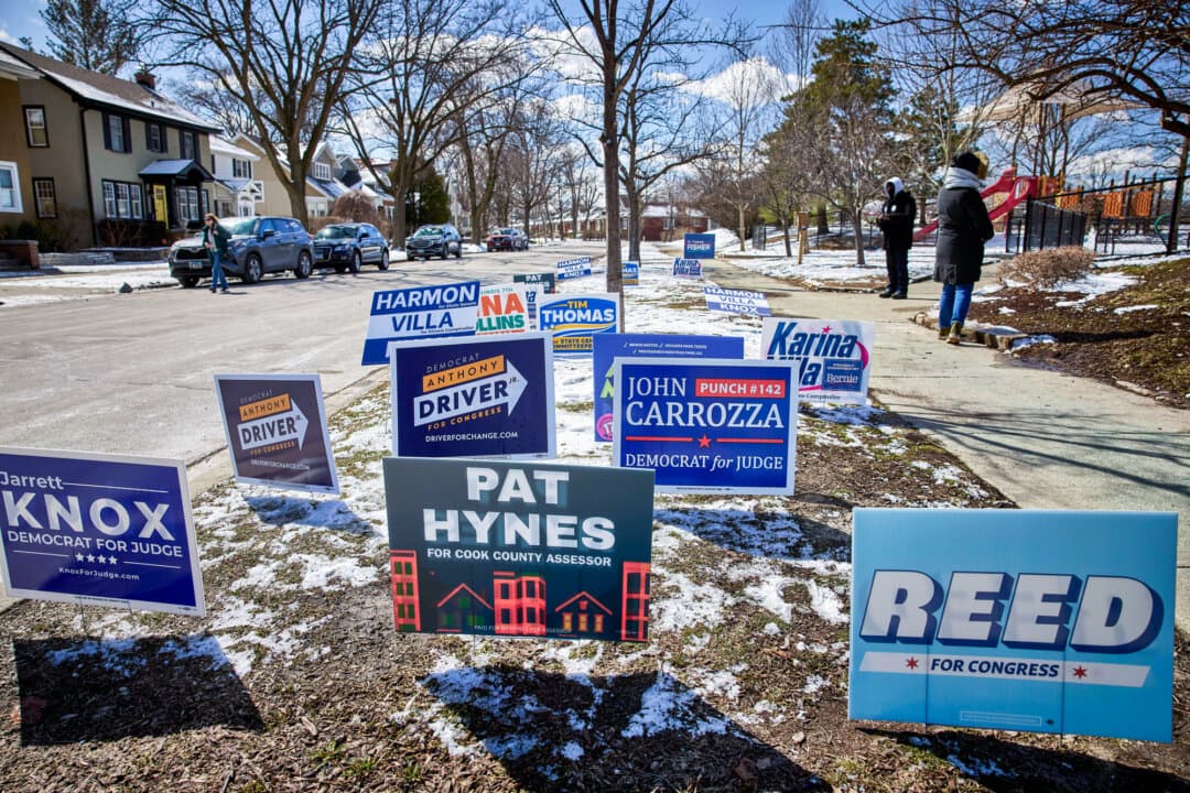 Campaign signs in Oak Park, Ill., on March 17, 2026. (Nathaniel Smith for The Epoch Times)