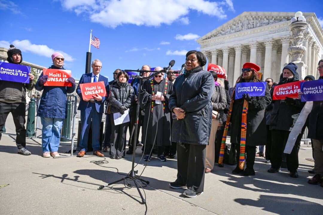 Guerline Jozef, cofounder and executive director of Haitian Bridge Alliance, speaks in front of the Supreme Court in Washington on March 16, 2026. The court agreed on March 16 to consider the Trump administration’s bid to strip Haitians and Syrians of temporary deportation protections. The Department of Homeland Security has announced plans to end so-called temporary protected status for some 350,000 Haitians and 6,000 Syrians. (Roberto Schmidt/AFP via Getty Images)