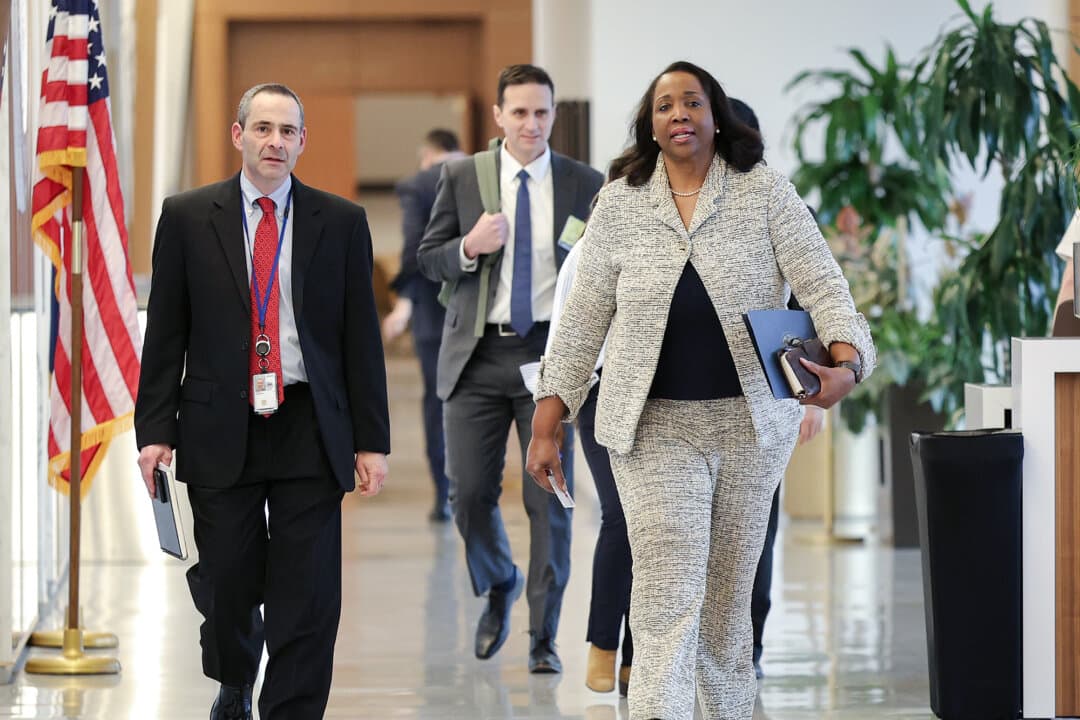 Federal Reserve board member Lisa Cook (R) arrives for a board meeting at the Federal Reserve building in Washington on March 19, 2026. (Kevin Dietsch/Getty Images)