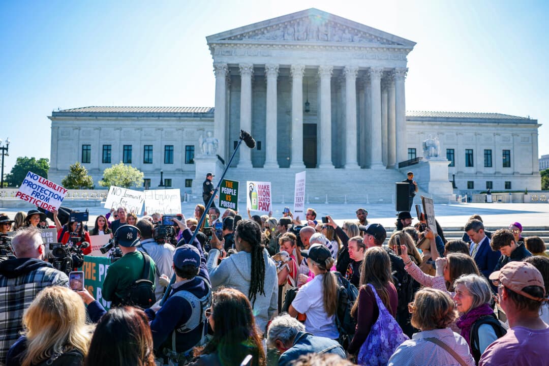 “The People v. Poison” protesters rallied to protest Bayer/Monsanto regarding cancer-linked risks from the Roundup weed killer outside the Supreme Court in Washington on April 27, 2026. (Tasos Katopodis/Getty Images)
