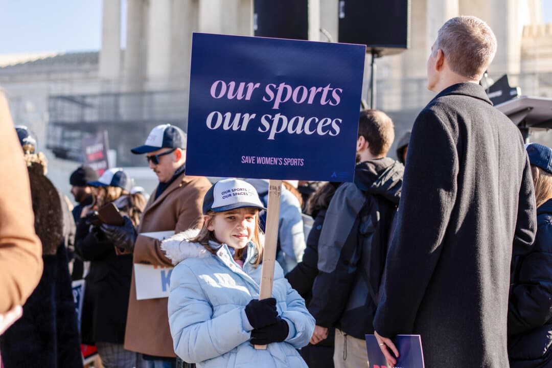 People take part in a rally outside the Supreme Court as justices hear arguments in two cases in which states have banned males from participating in female-only sports in Washington on Jan. 13, 2025. (Madalina Kilroy/The Epoch Times)