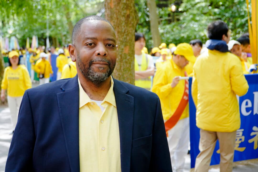 Lawrence Rweyemamu, 50, has practiced Falun Gong since 2009. He is standing Dag Hammarskjöld Plaza, where practitioners of Falun Gong prepare for a parade celebrating World Falun Dafa Day, May 13, 2026. (Nicholas Zifcak/The Epoch Times)