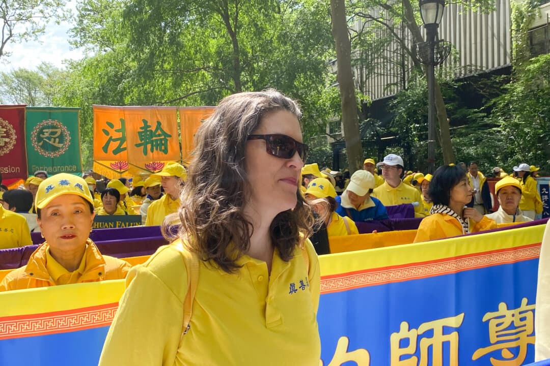 Vivian LaFarge, 49, she started practicing in 2018. She and other adherents of the practice lined up in Dag Hammarskjöld Plaza, to prepare for a parade celebrating World Falun Dafa Day, May 13, 2026. (Nicholas Zifcak/The Epoch Times)