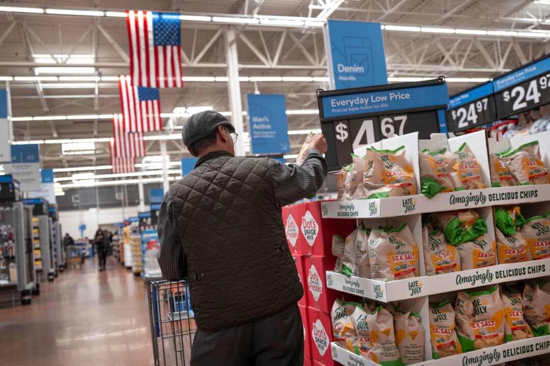 Customers shop at a Walmart store in Chicago on May 13, 2026. Walmart has reported plans to cut or relocate about 1,000 corporate workers as it seeks to streamline its global technology teams. (Scott Olson/Getty Images)