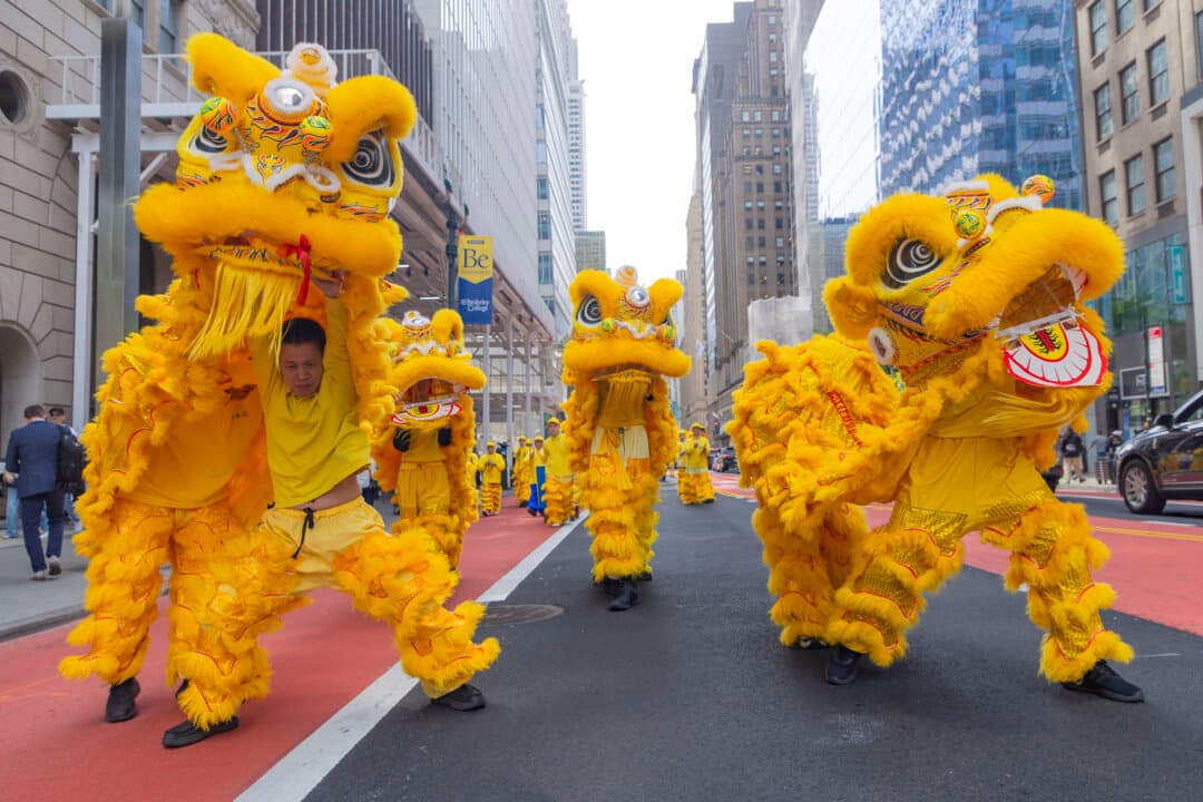 Falun Gong practitioners take part in a parade to celebrate World Falun Dafa Day and call for an end to persecution in China, in New York City, on May 13, 2026. (Mark Zou/The Epoch Times)