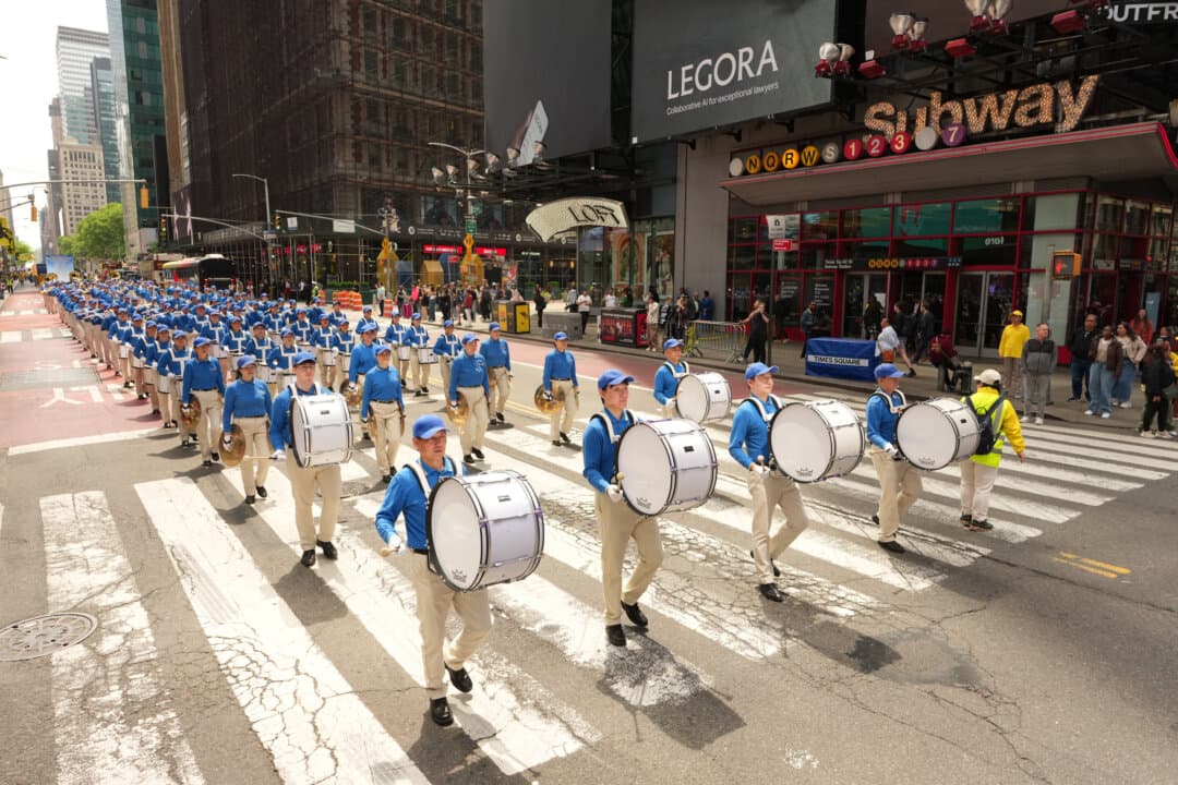 Falun Gong practitioners take part in a parade to celebrate World Falun Dafa Day and call for an end to persecution in China, in New York City, on May 13, 2026. (Larry Dye/The Epoch Times)