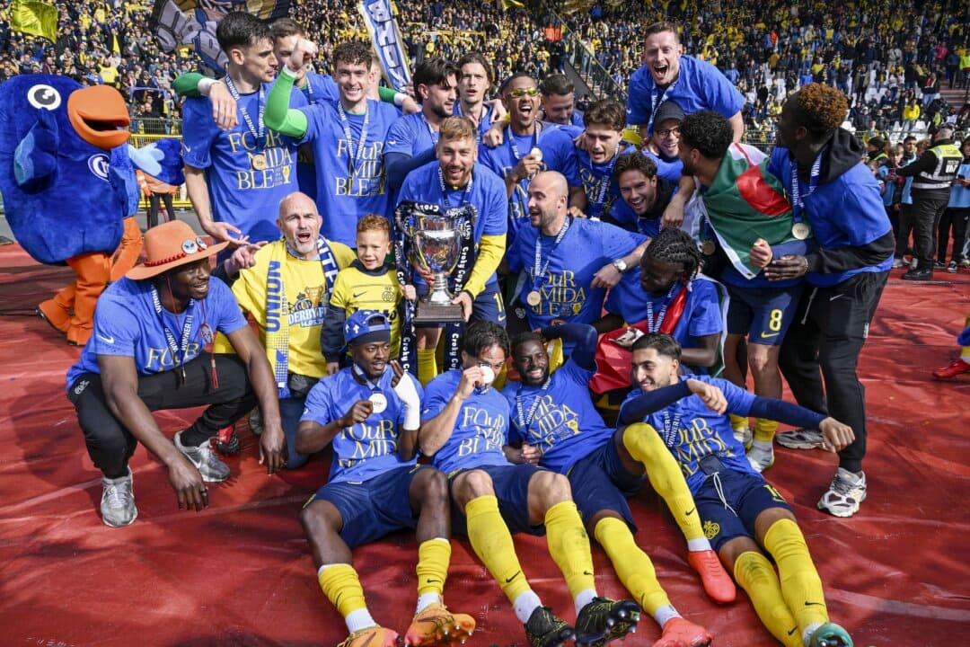 Union's players celebrate with the cup after winning a soccer game between Royale Union Saint-Gilloise and RSC Anderlecht, the final of the “Croky Cup” Belgian cup in Brussels on May 14, 2026. (Tom Goyvaerts/BELGA MAG/Belga/AFP via Getty Images)