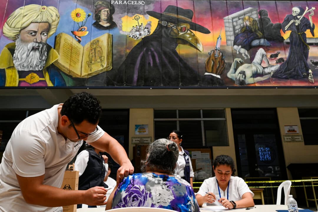 A woman is vaccinated by a medical student during a campaign against measles at Metropolitan University Center in Guatemala City on May 14, 2026. (Johan Ordonez/AFP via Getty Images)