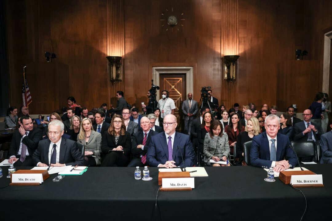 (L–R) Joaquin Duato, CEO of Johnson & Johnson, Robert Davis, CEO of Merck, and Chris Boerner, CEO of Bristol Myers Squibb, testify before the Senate Health, Education, Labor, and Pensions Committee in Washington on Feb. 8, 2024. The Committee held the hearing to investigate the cost of prescription drugs. (Kevin Dietsch/Getty Images)