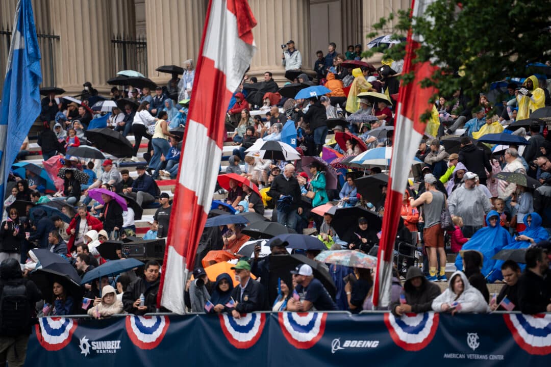 People watch the National Memorial Day parade in Washington on May 25, 2026. (Madalina Kilroy/The Epoch Times)
