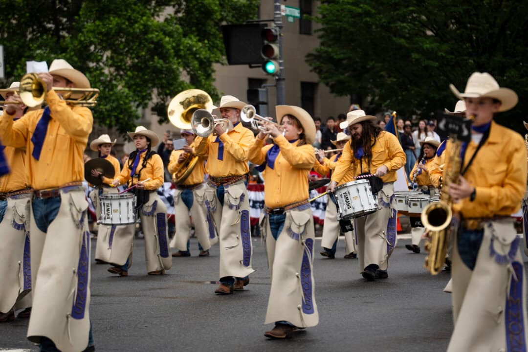The Cowboy Band of Hardin-Simmons University of Texas takes part during the National Memorial Day parade in Washington on May 25, 2026. (Madalina Kilroy/The Epoch Times)