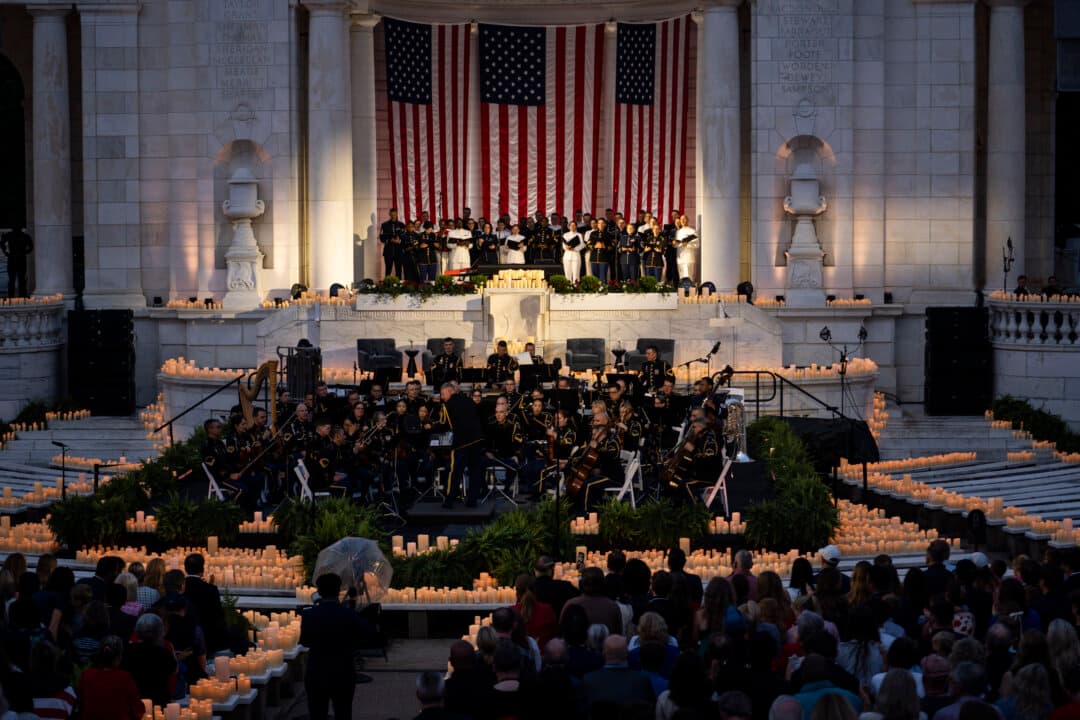 The U.S. Army Orchestra and Joint Armed Forces Chorus perform during an event titled “Freedom 250 National Memorial Day Observance: An Evening of Stories and Service” at the Arlington National Cemetery’s Memorial Amphitheater in Arlington, Va., on May 25, 2026. (Madalina Kilroy/The Epoch Times)