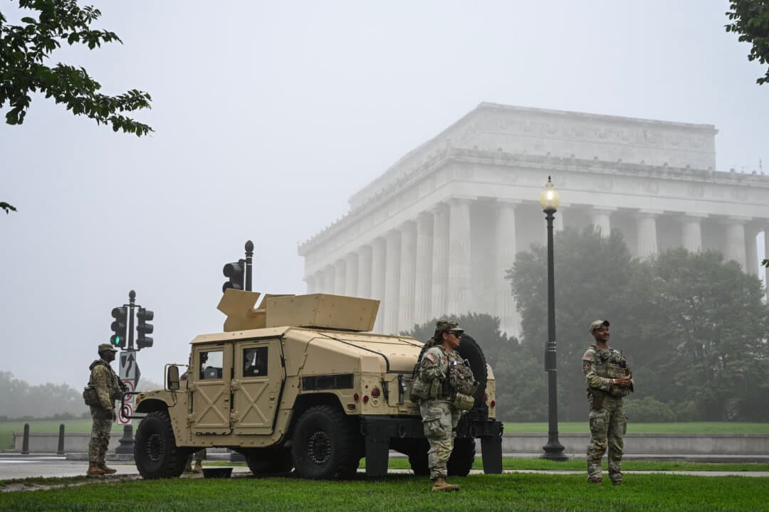National Guard members stand watch near the Lincoln Memorial on the morning of Memorial Day in Washington on May 25, 2026. (Alex Wroblewski/AFP via Getty Images)