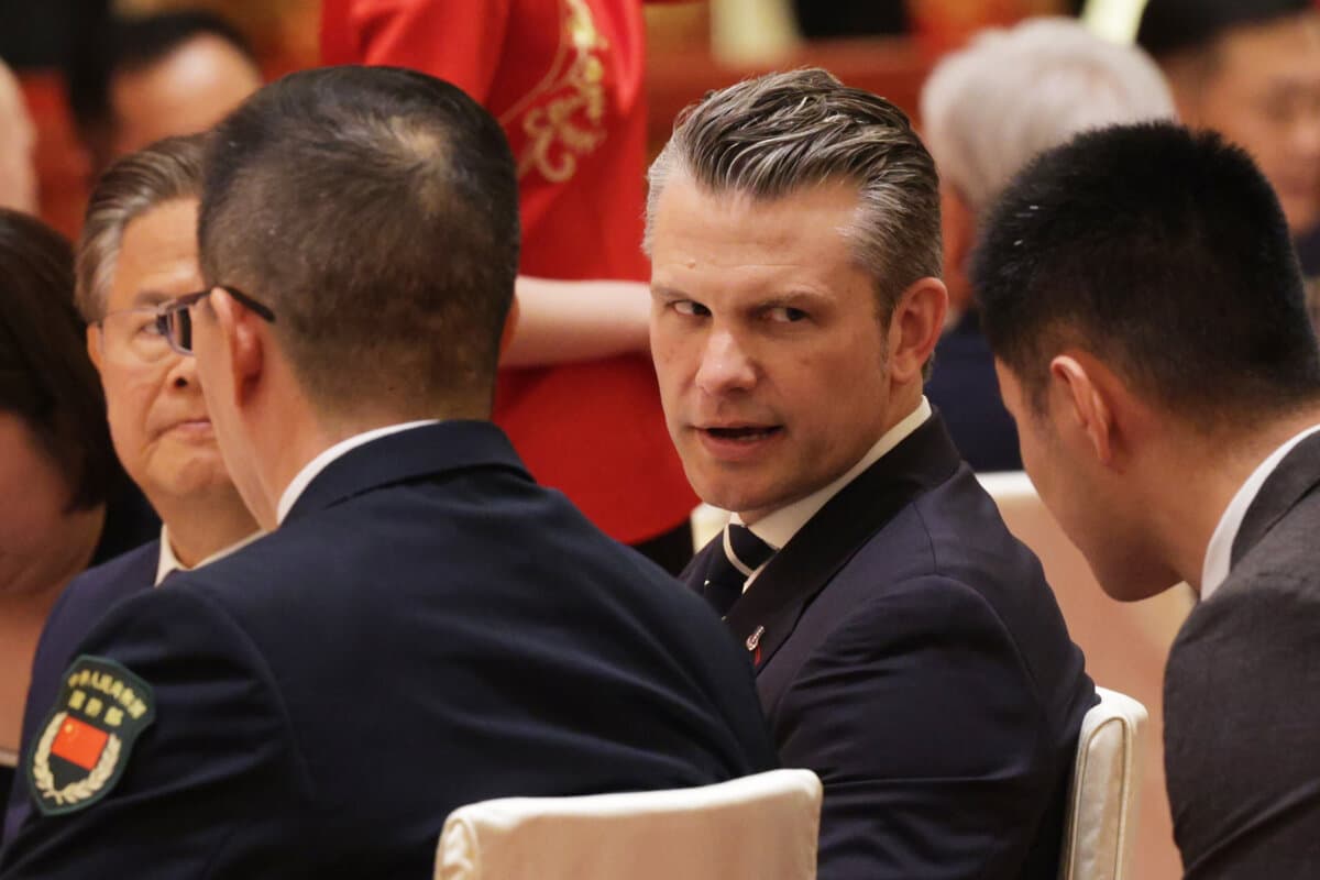 U.S. Secretary of War Pete Hegseth and Chinese defense minister Dong Jun (L) attend a state banquet in Beijing on May 14, 2026. (Alex Wong/Getty Images)