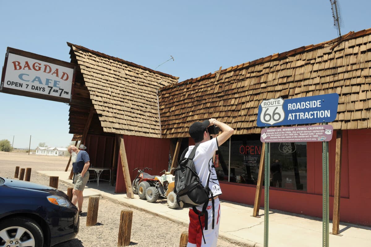 A French tourist takes pictures of the Bagdad Cafe on May 29, 2008 in the Mojave Desert on Route 66, in Newberry Springs, California. The establishment used in the movie "Bagdad Cafe", about 40(63 km) miles west of the original Bagdad site on historic Route 66 outside the town of Newberry Springs, was originally named the Sidewinder Cafe, but after its use as a filming location was later changed to the Bagdad Cafe. (Gabriel Bouys/AFP/Getty Images/TNS)