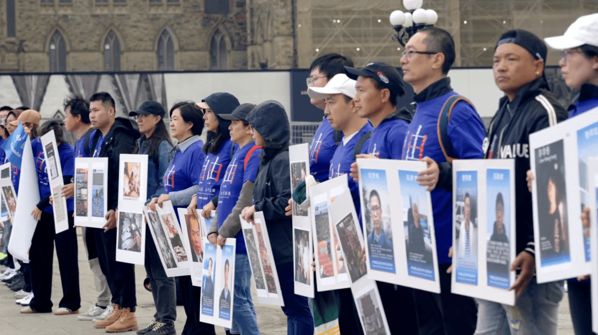 Members of the Canadian Committee of the Democracy Party of China protest in Ottawa as Chinese Foreign Minister Wang Yi meets with Canadian Foreign Affairs Minister Anita Anand and Prime Minister Mark Carney on May 29, 2026. (NTD)